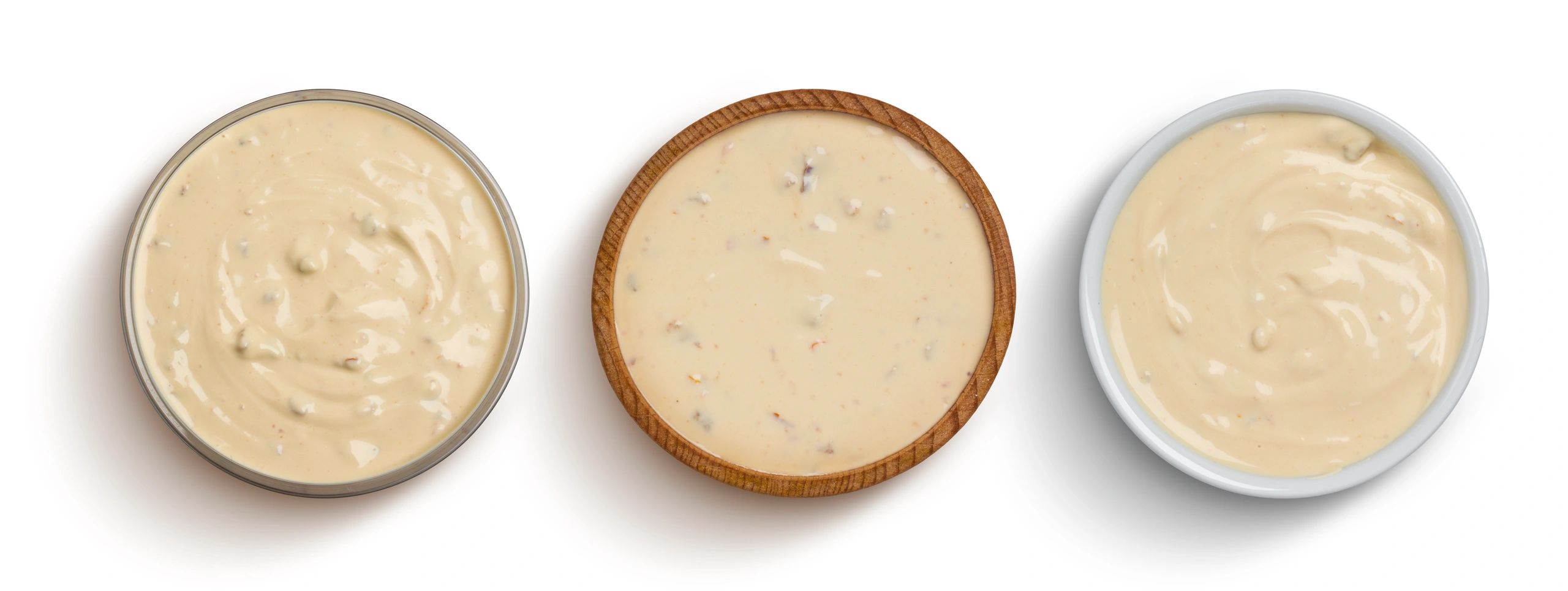sauces in bowls on white background